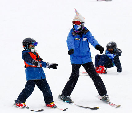 Guests participate in ski lessons at Snow Creek
