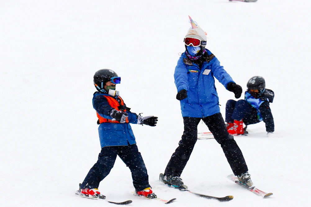 Guests participate in ski lessons at Snow Creek