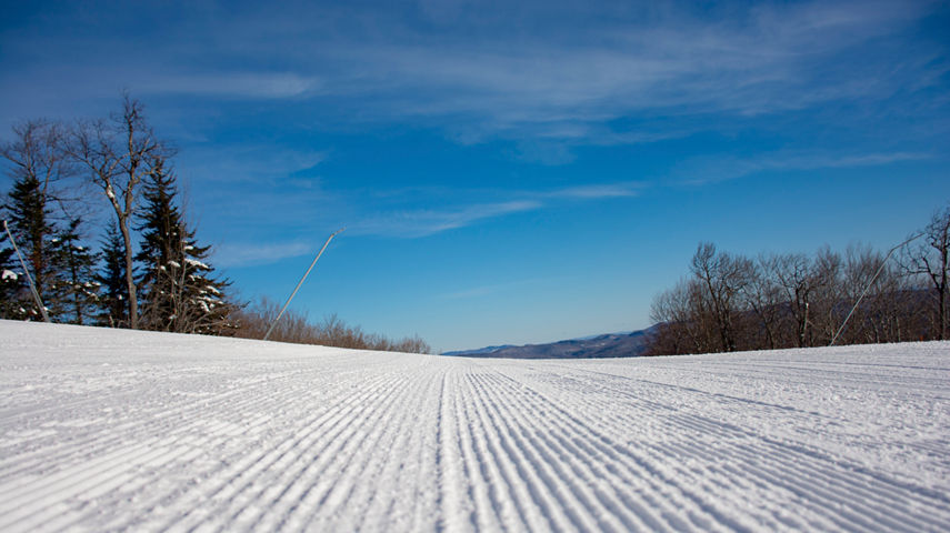 The view of a groomed trail at Okemo