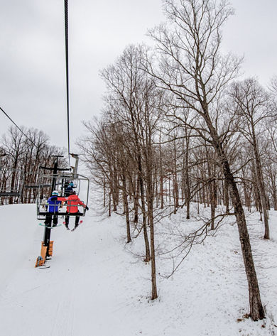 Skiers on Chairlift at Paoli Peaks