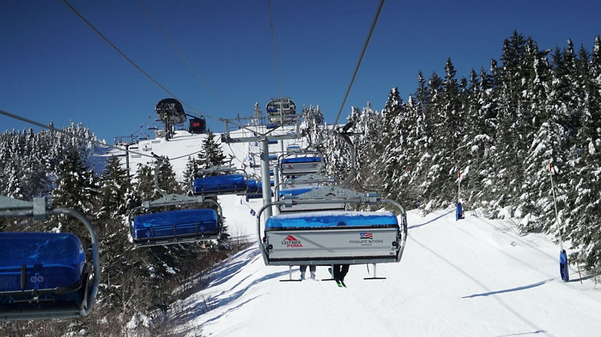 Bluebird Express over Lodge with Blue Skies and Snowy Trees at Mount Snow