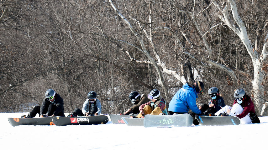 Guests participate in snowboard lessons at Snow Creek