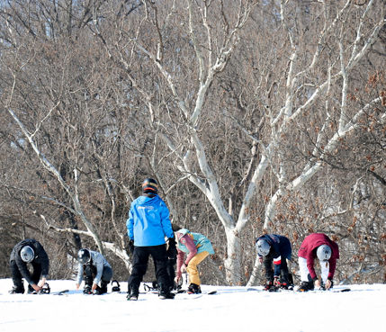 Guests participate in snowboard lessons at Snow Creek