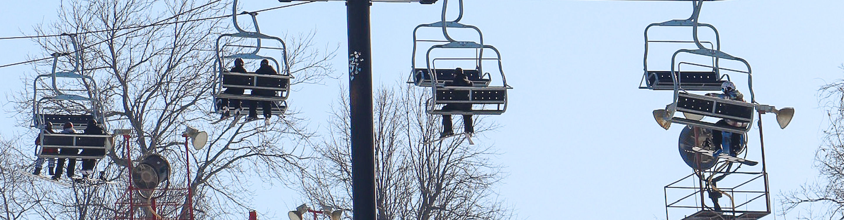 Guests enjoy the chairlift ride at Snow Creek