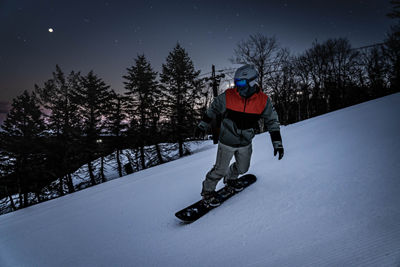 Adult Male Snowboarding at Night at Big Boulder