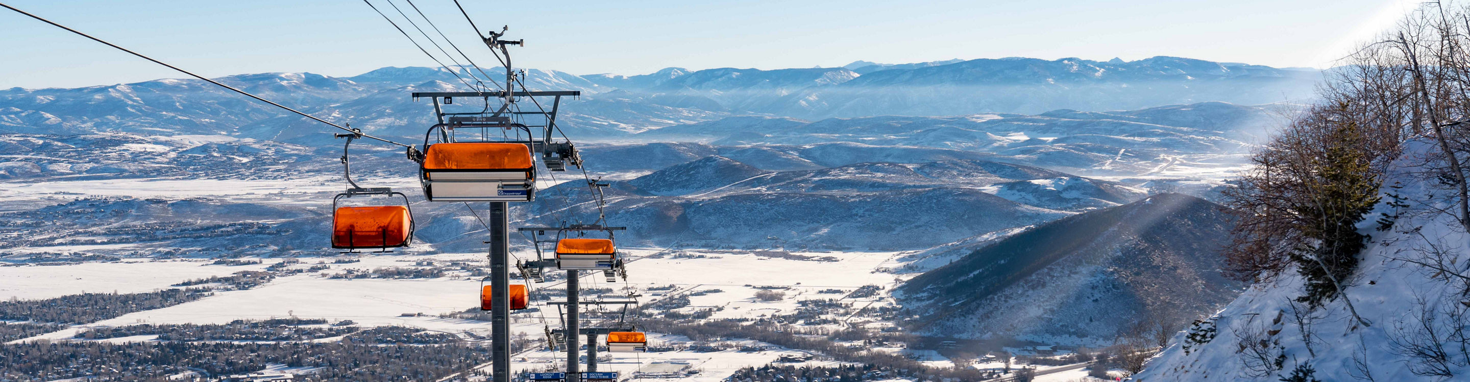 Woman Skiing under Gondola at Park City