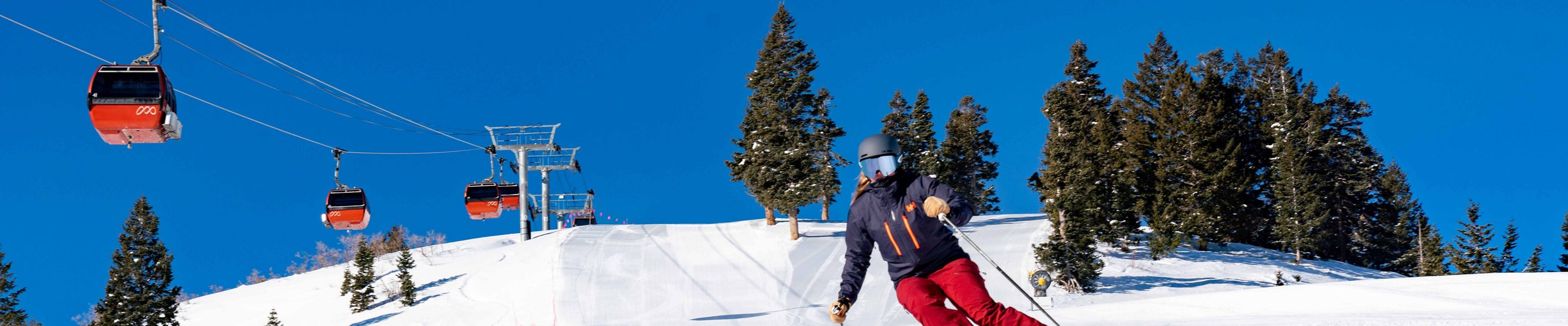 Woman Skiing under Gondola at Park City