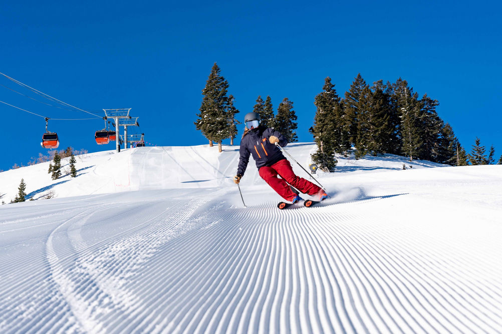 Woman Skiing under Gondola at Park City