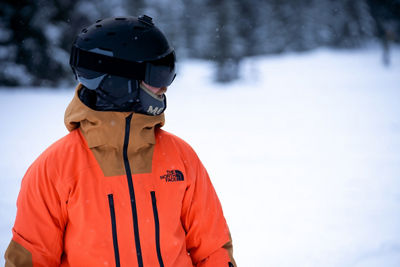 A snowboarder wears The North Face jacket while snowboarding at Whistler