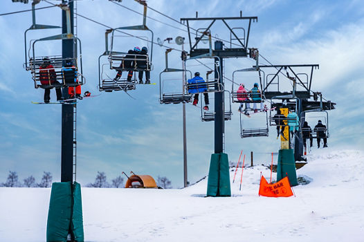 Guests ride on a chairlift during New Years Eve Day at Alpine Valley