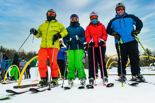 Skiers pose on New Years Eve Day at Alpine Valley