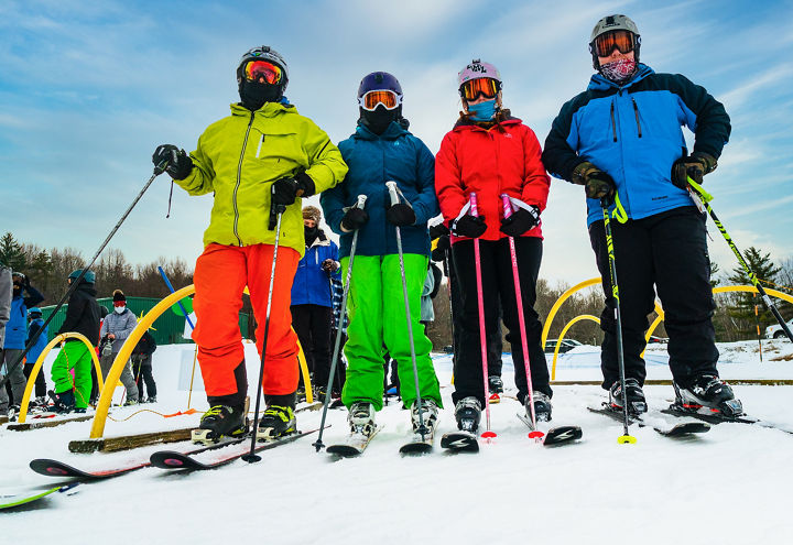 Skiers pose on New Years Eve Day at Alpine Valley