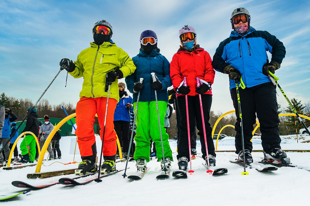 Skiers pose on New Years Eve Day at Alpine Valley