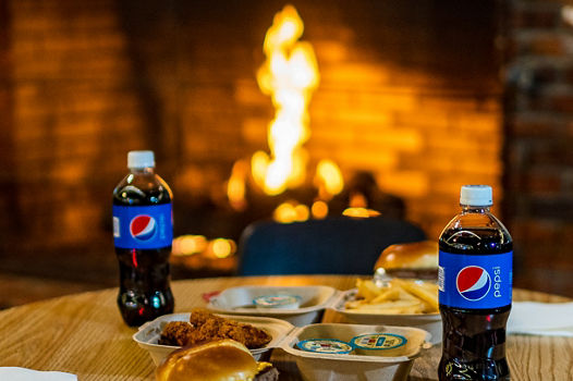 Dining in front of a fireplace at Alpine Valley