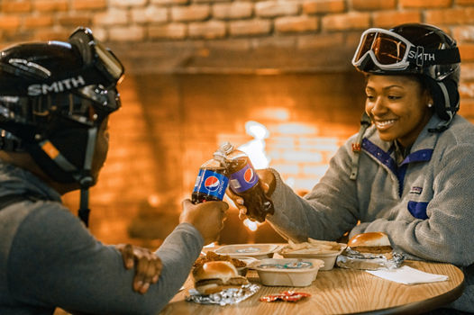 A couple shares Pepsi at Alpine Valley