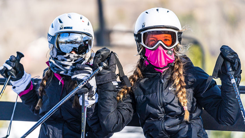 Girls pose on the chairlift at Alpine Valley