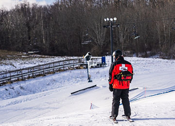 Ski patrol looks at snow conditions at Alpine Valley