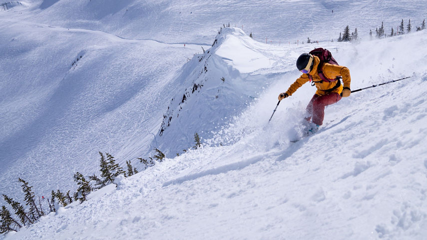 A woman skis the black diamond run - Sun Bowl at Whistler Mountain