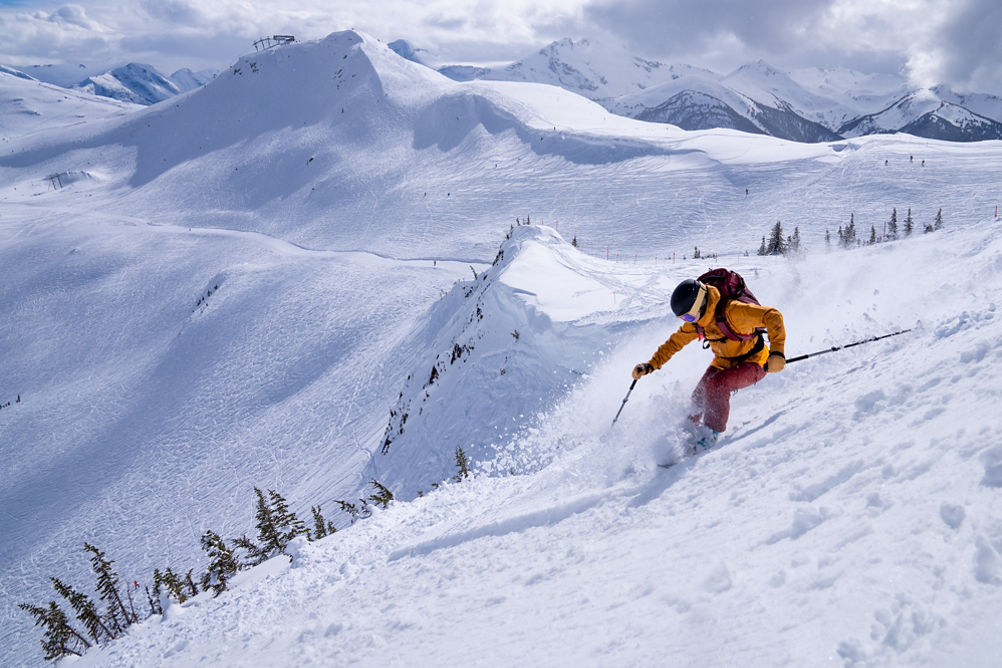 A woman skis the black diamond run - Sun Bowl at Whistler Mountain