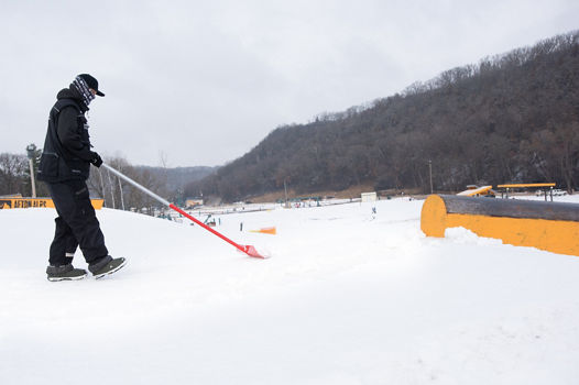 Terrain Park Crew shovels snow while at Afton Alps, MN