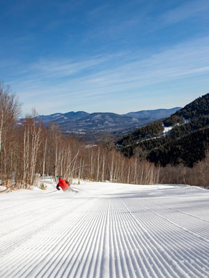 A groomed view of Attitash on a spring day