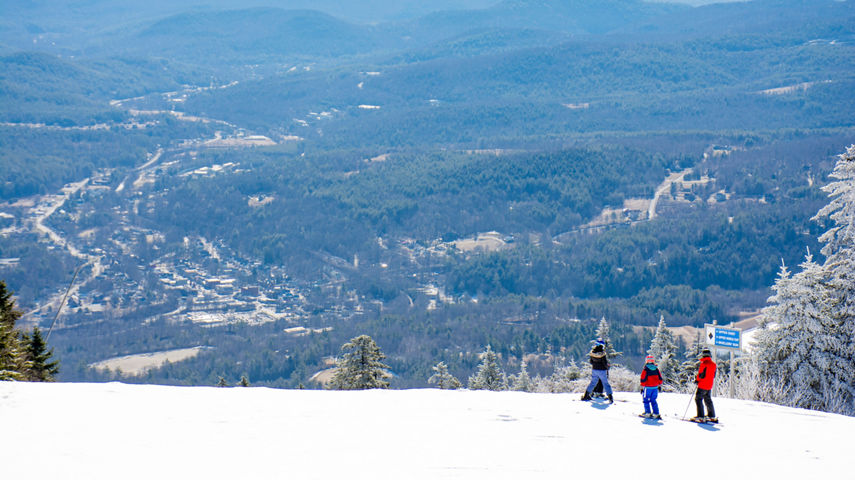 Guests ski at Okemo overlooking the view