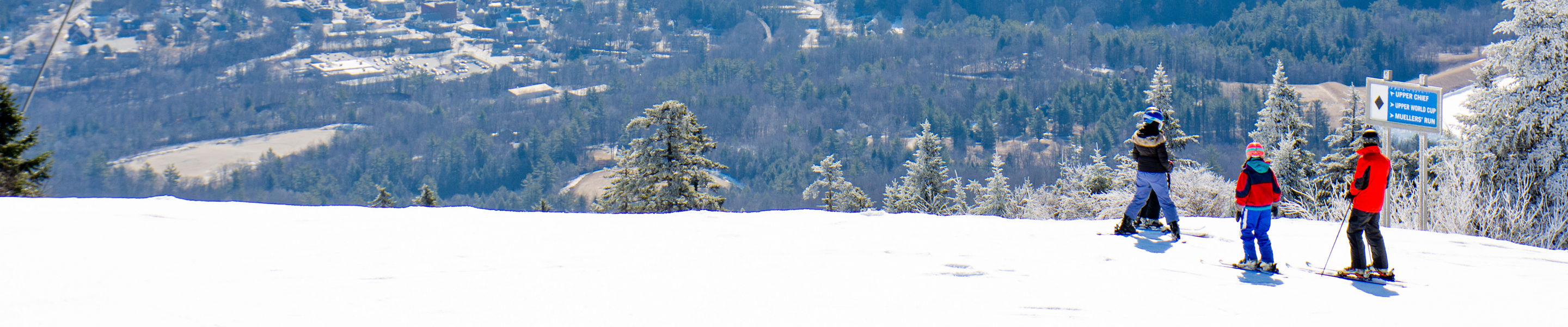 Guests ski at Okemo overlooking the view