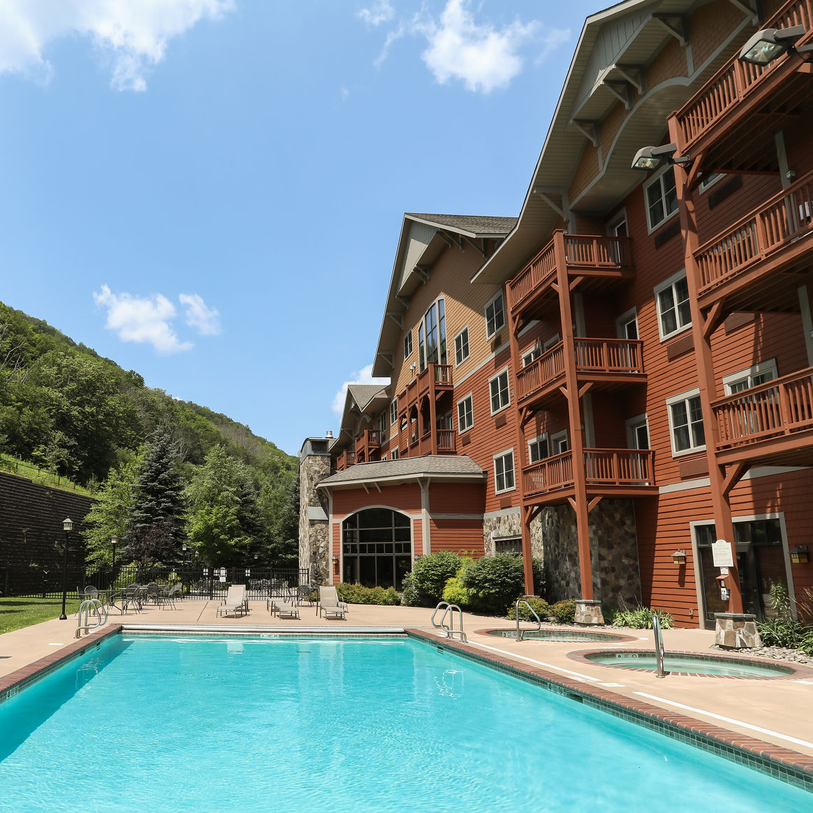 Outdoor Pool at the Kaatskill Mountain Club on a Sunny Day Outside of Condo at Hunter Mountain Resort