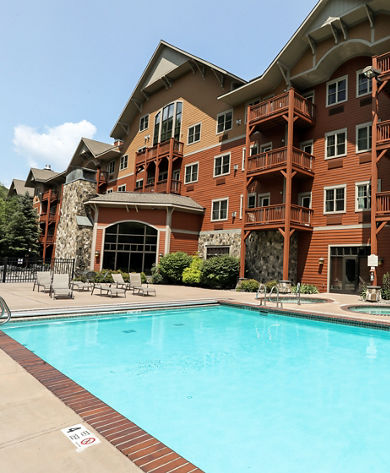 Outdoor Pool at the Kaatskill Mountain Club on a Sunny Day Outside of Condo at Hunter Mountain Resort