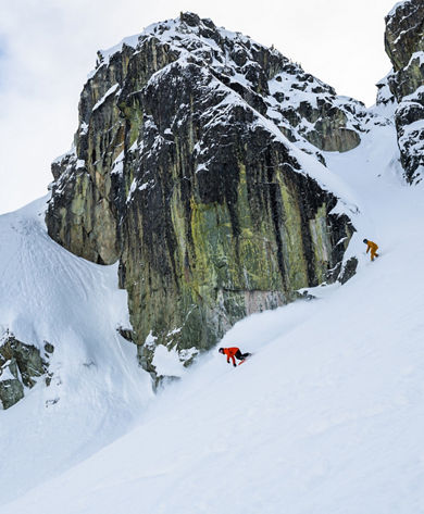 Adults snowboarding with an instructor