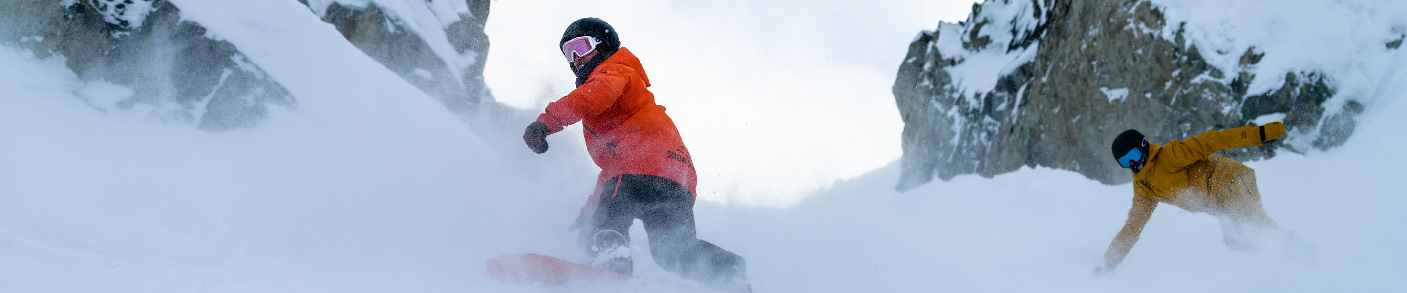 Adults snowboarding with instructor