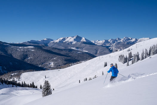 Skier Enjoys Powder in China Bowl in Vail, CO