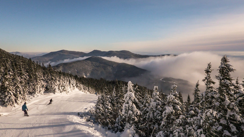 Skiers Descend Snowy Mountain at Stowe