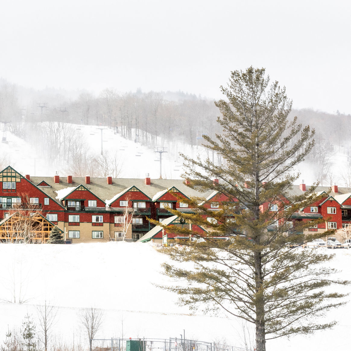 Scenic View of the Exterior of the Grand Summit Hotel on a Snowy Day at the Mount Snow Resort