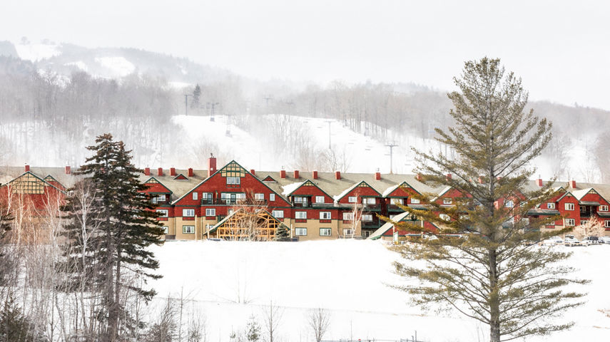 Scenic View of the Exterior of the Grand Summit Hotel on a Snowy Day at the Mount Snow Resort