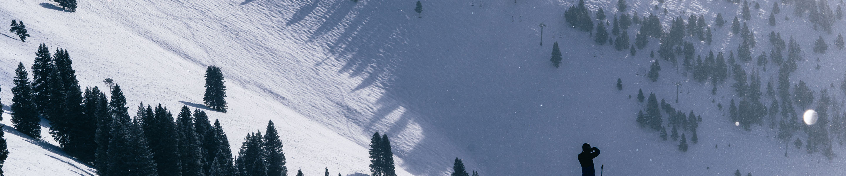 Skier Enjoys View Over Sun Up Bowl in Vail, CO