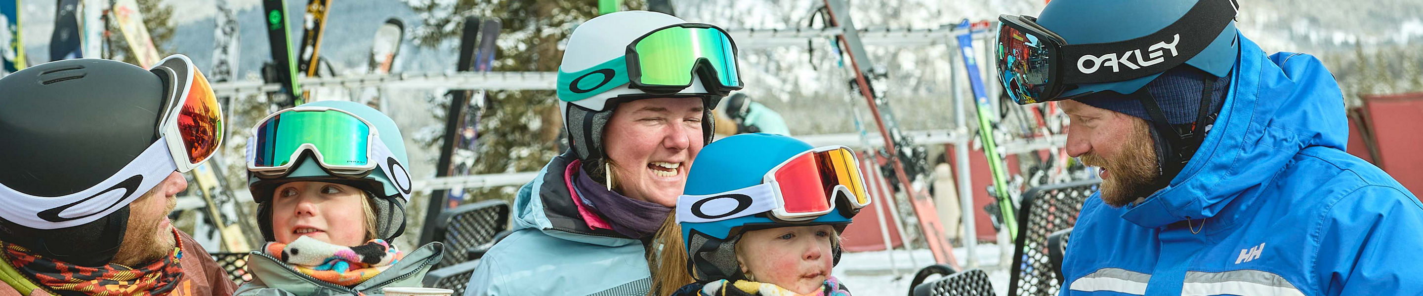 Family skiing with an instructor in a private lesson