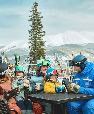 Family skiing with an instructor in a private lesson
