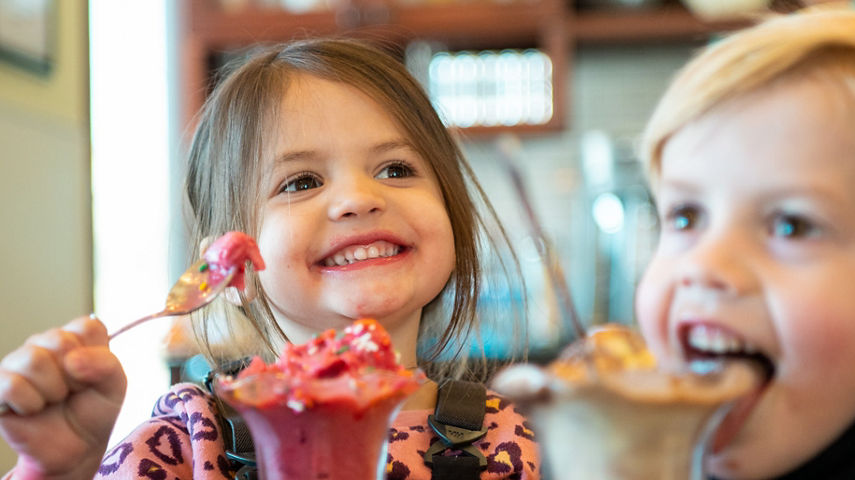 Young children eating ice cream at Ice Cream Parlour
