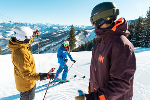 Adults skiing with an instructor