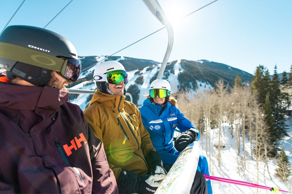 Adults skiing with an instructor