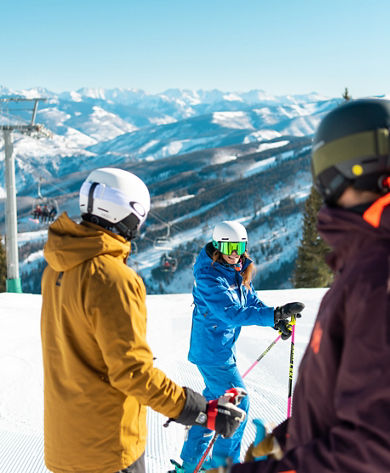 Adults skiing with an instructor