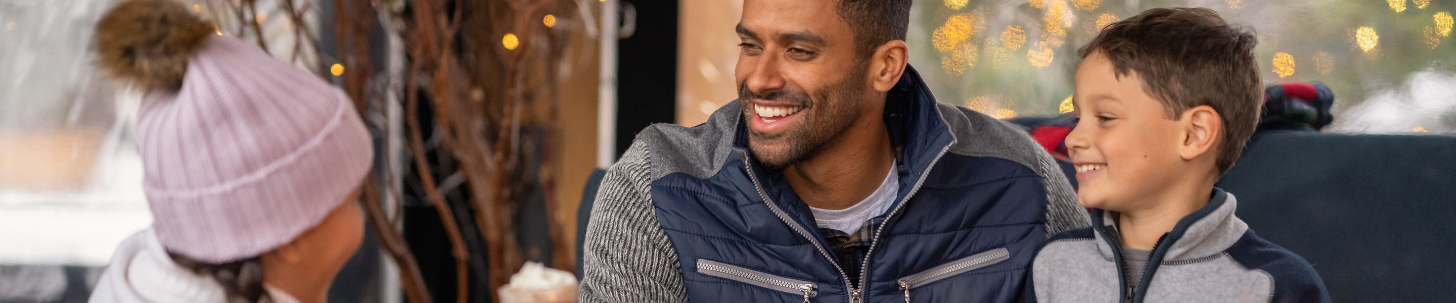 Family Drinking Hot Chocolate by a Fire at Stowe