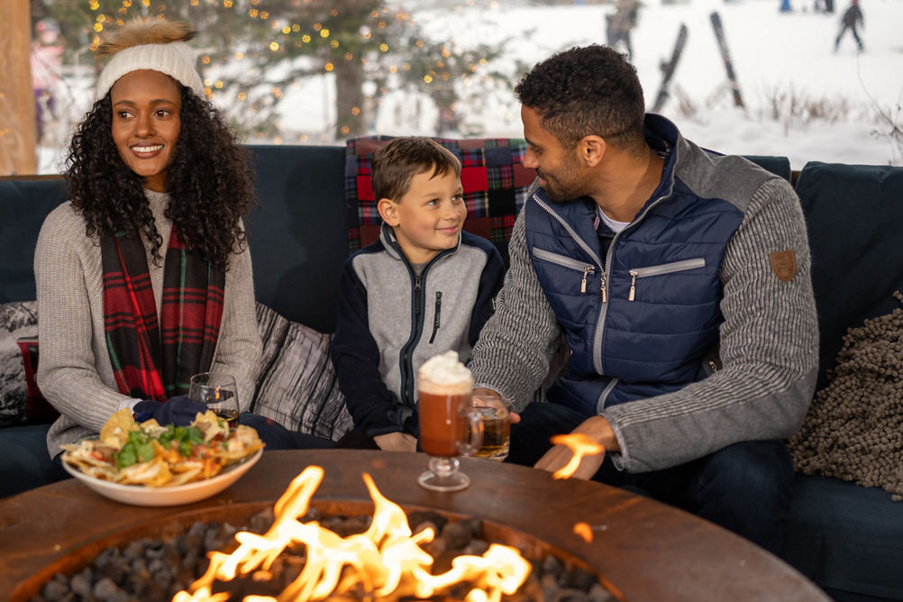 Family Enjoying Apres at Stowe Near a Fire
