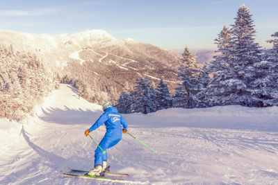 Ski Instructor in a Blue Jacket Hitting a Run at Stowe