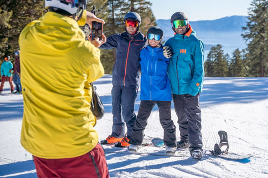 Skiers at the Lake Tahoe East Ridge Overlook