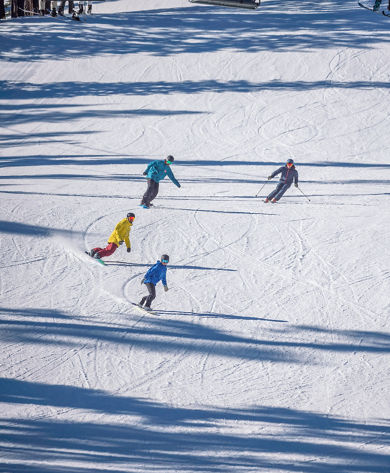 Friends skiing and riding at Northstar
