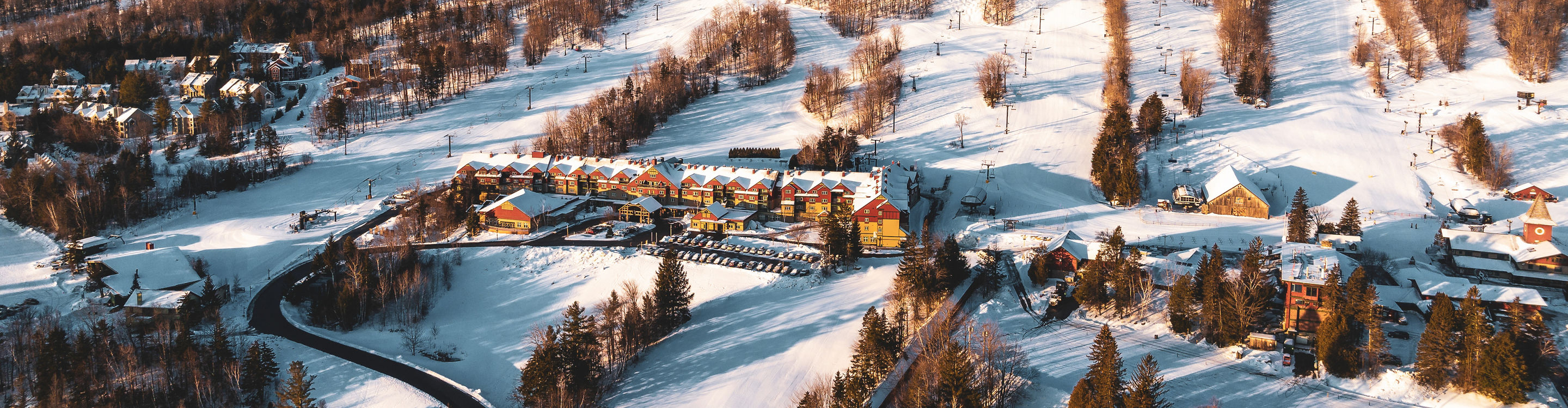Full Mountain View of Mount Snow at Sunrise with Grand Summit, Bluebird Barn, Main Base Lodge, Clocktower