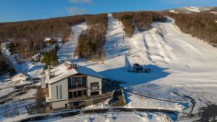 Aerial View of Carinthia Base Lodge with Trails in Background
