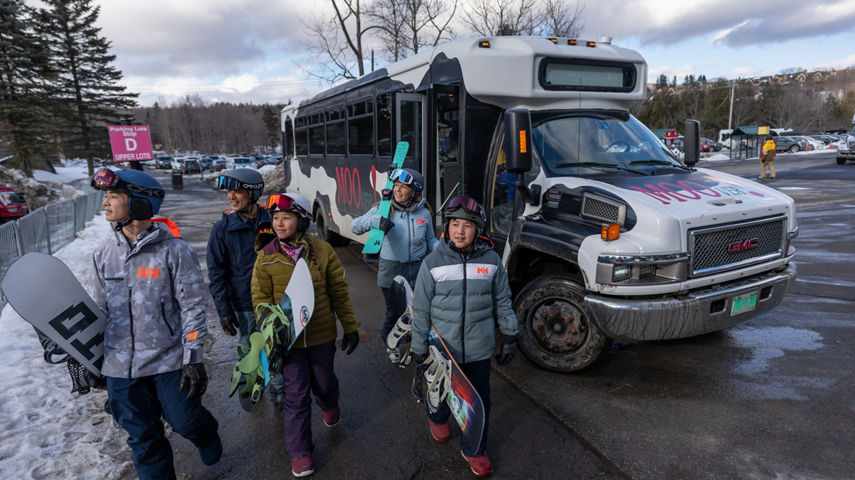 Family Carrying Equipment Walks from MOOver Dropoff in Main Base Area